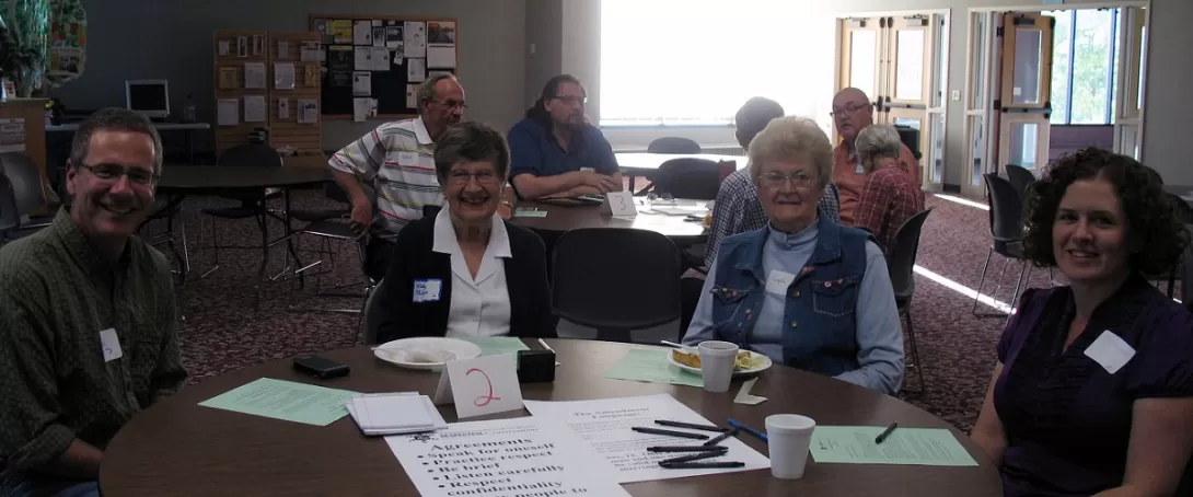 People sitting around tables
